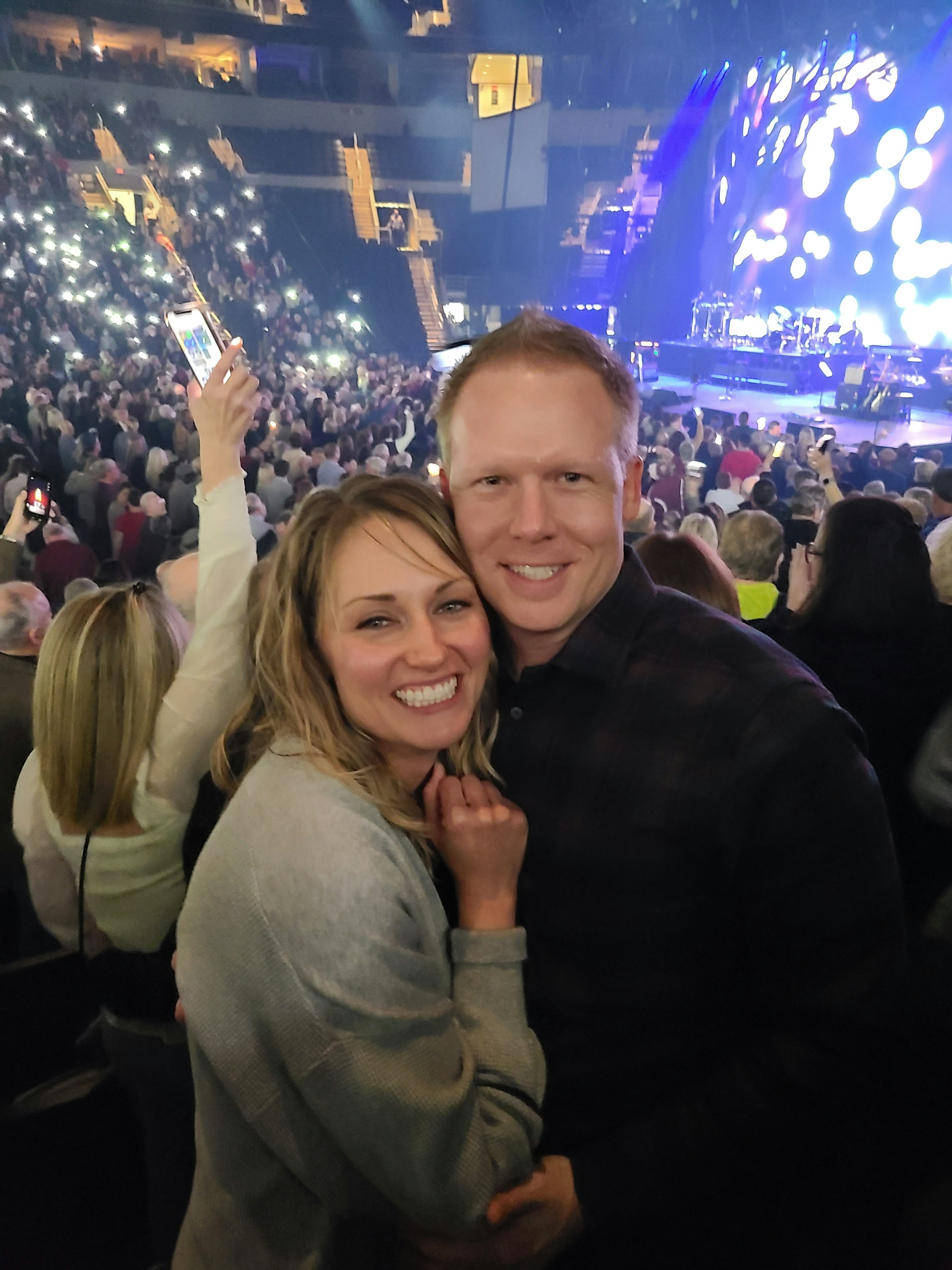 Chris and his wife enjoy live music. Here they are at James Taylor!